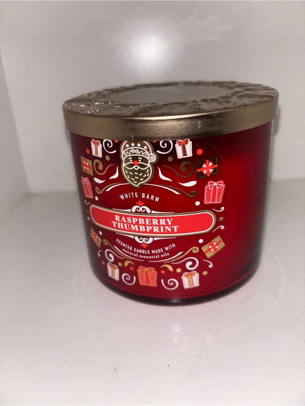 White Barn Raspberry Thumbprint Candle in Festive Red and Gold